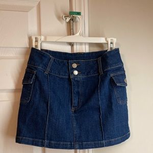 Mini jean skirt. Dark denim. Never worn.